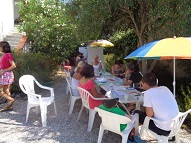 An adult intermediate group in the garden with their teacher