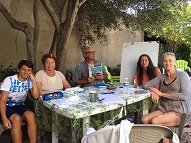 An advanced morning group in the garden with Michel the teacher in charge